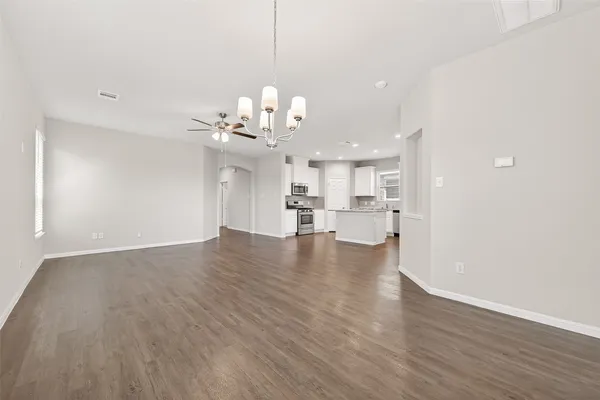 a kitchen with stainless steel appliances granite countertop a stove and a microwave
