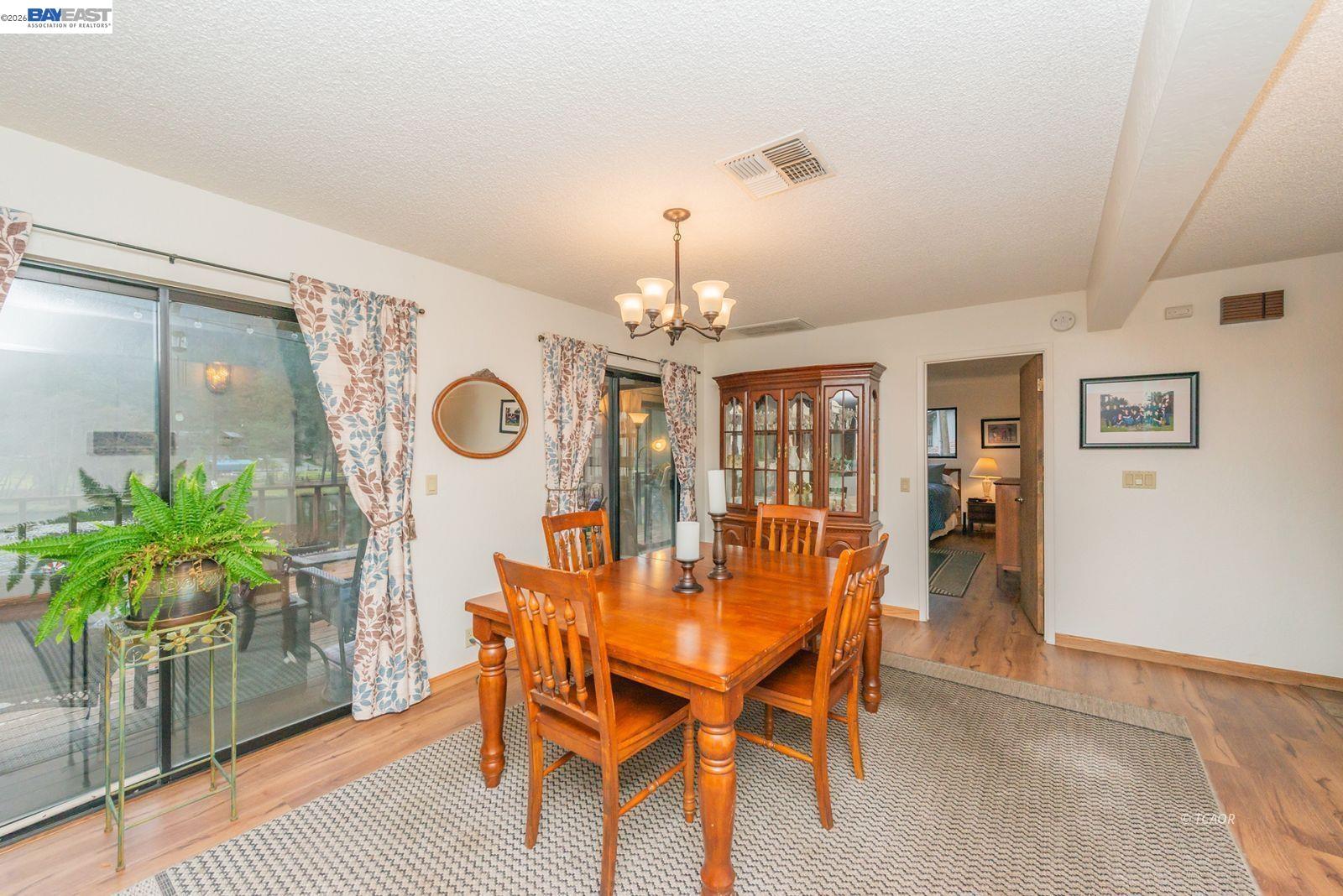 2393 Poker Bar Road Douglas City, CA 96024 - Photo 15 of 52 a view of a dining room with furniture and chandelier