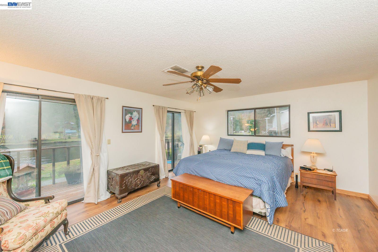 2393 Poker Bar Road Douglas City, CA 96024 - Photo 17 of 52 a bedroom with a bed and a chandelier