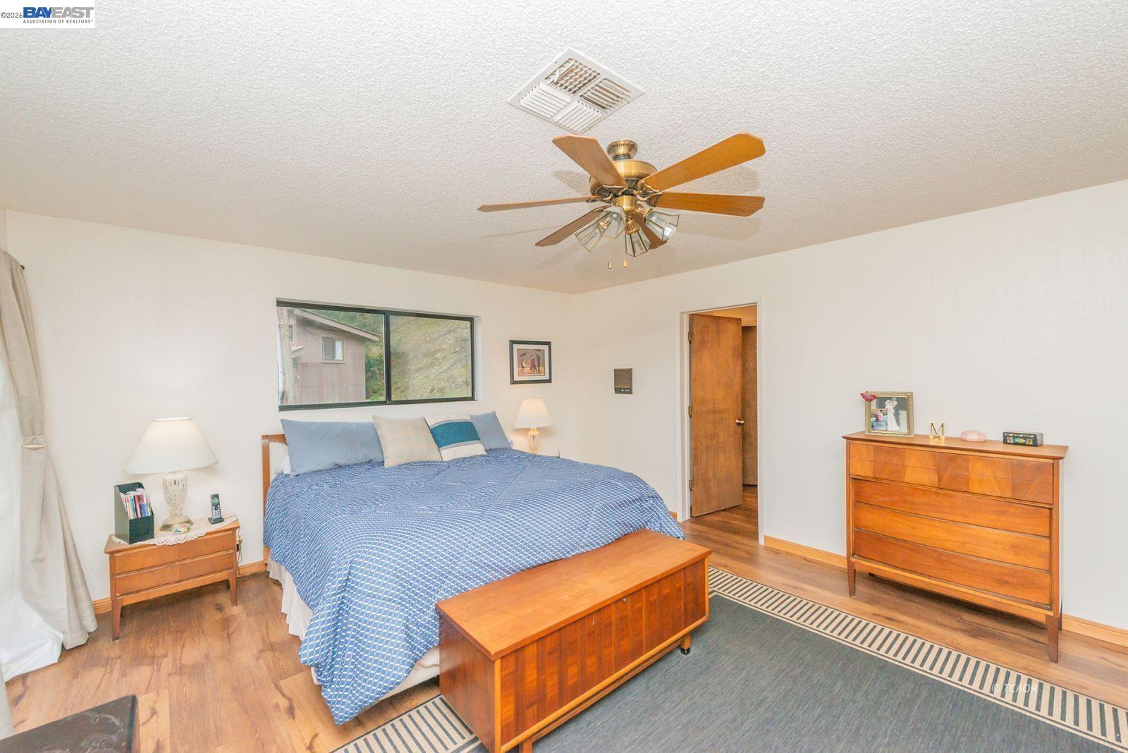 2393 Poker Bar Road Douglas City, CA 96024 - Photo 18 of 52 a bedroom with a bed and a chandelier
