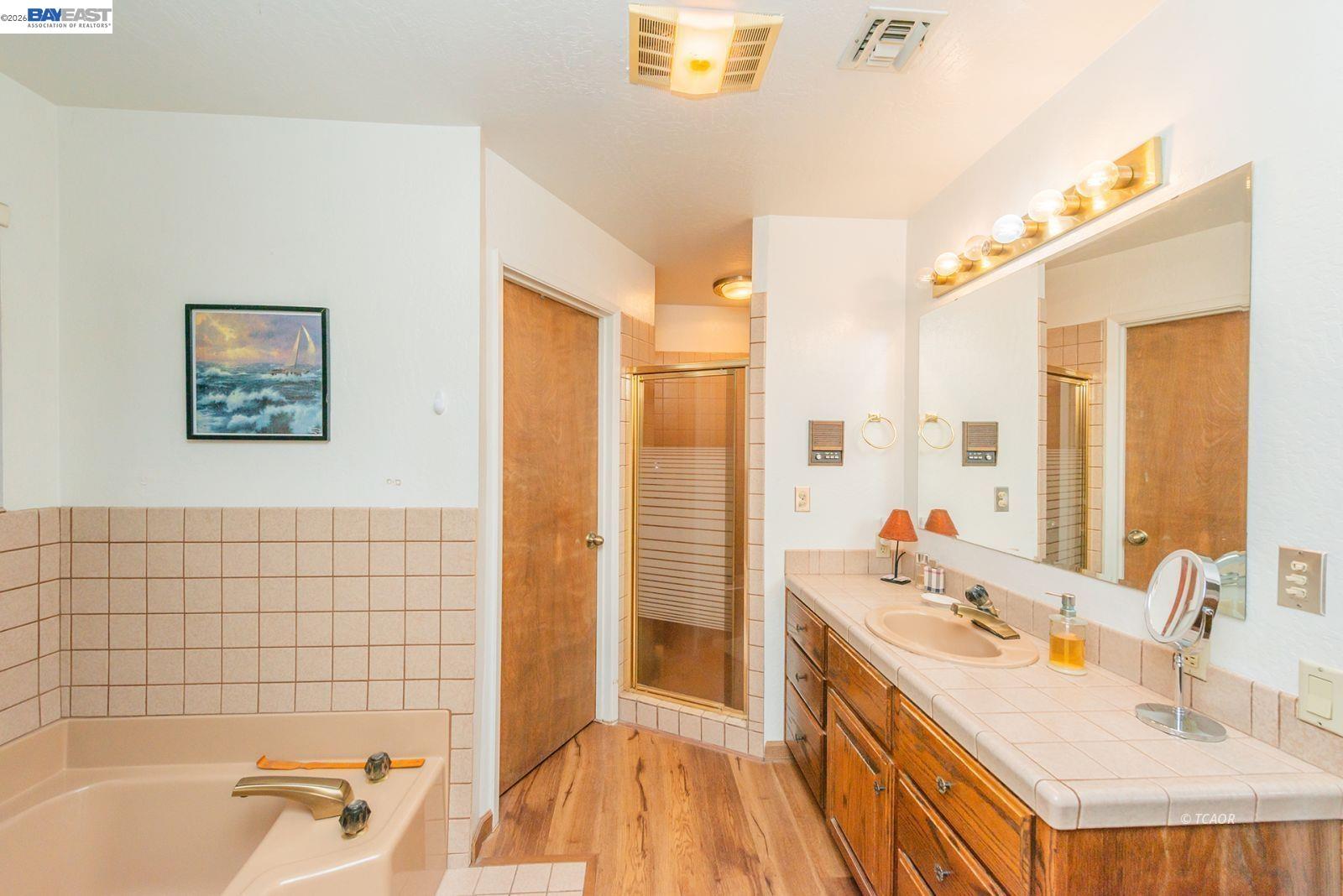 2393 Poker Bar Road Douglas City, CA 96024 - Photo 20 of 52 a bathroom with a tub sink and a mirror