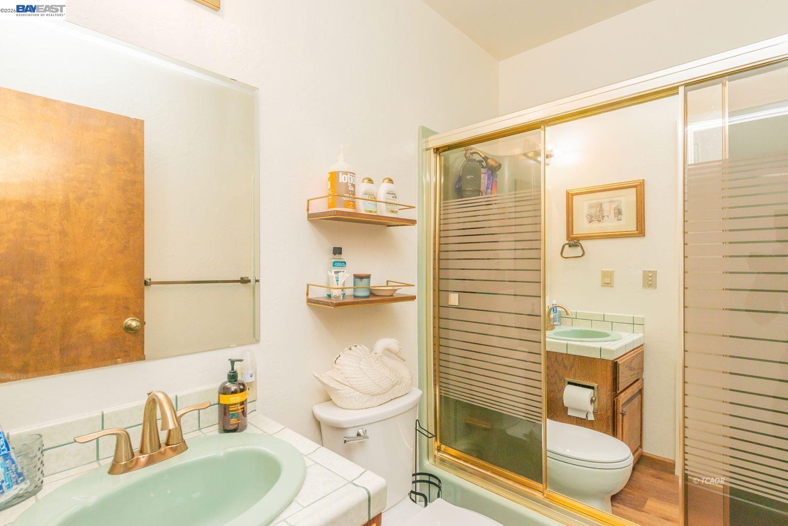 2393 Poker Bar Road Douglas City, CA 96024 - Photo 23 of 52 a bathroom with a sink a toilet and shower curtain