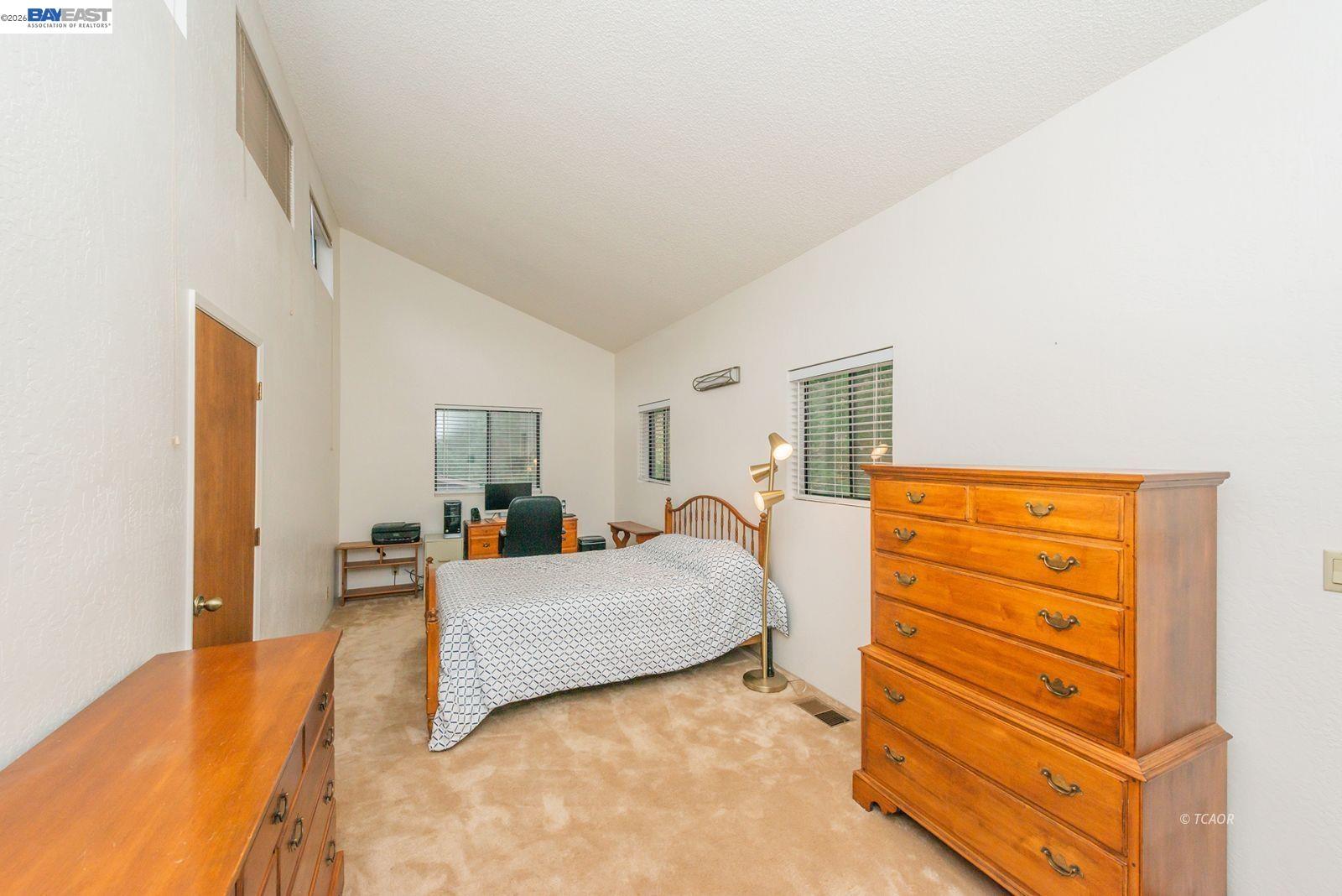 2393 Poker Bar Road Douglas City, CA 96024 - Photo 24 of 52 a bedroom with a bed and wooden floor