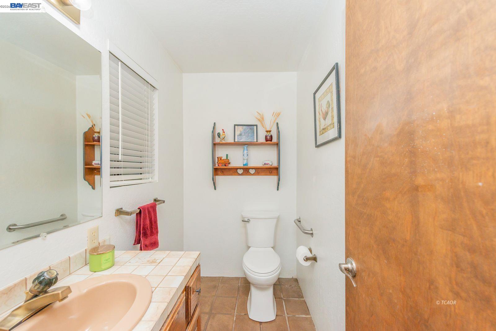 2393 Poker Bar Road Douglas City, CA 96024 - Photo 25 of 52 a bathroom with a sink toilet and mirror