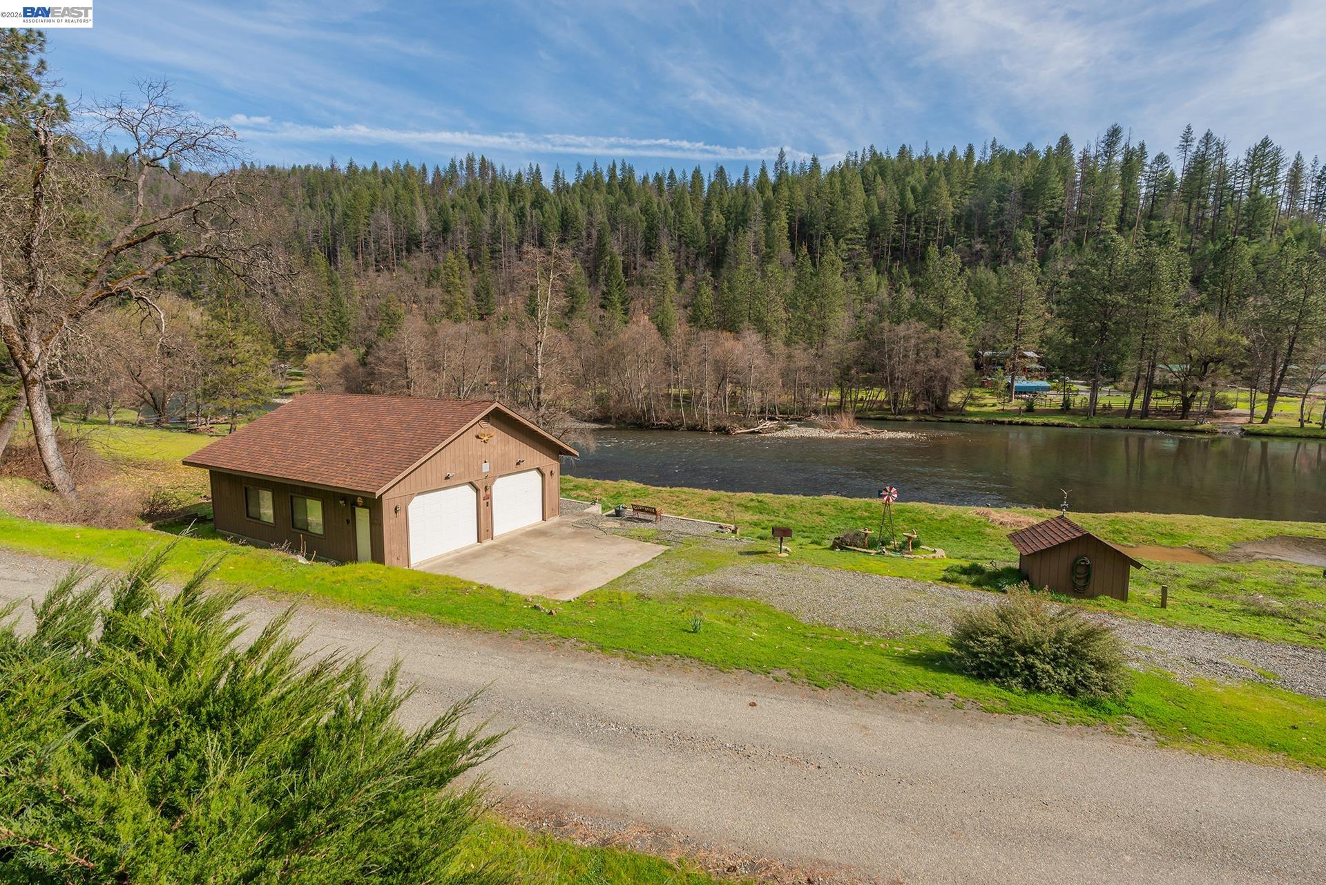 2393 Poker Bar Road Douglas City, CA 96024 - Photo 32 of 52 an aerial view of a house with a yard and lake view