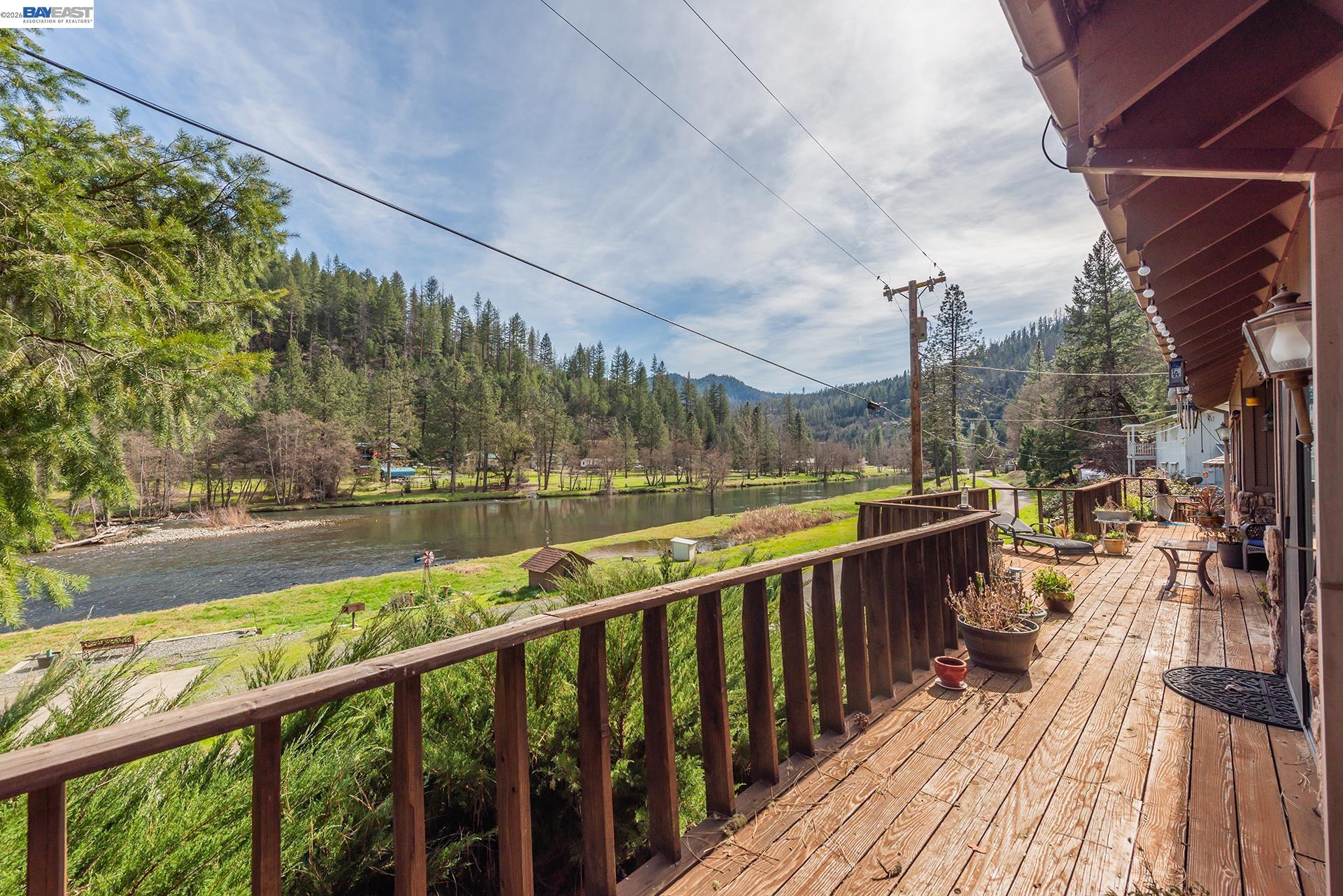 2393 Poker Bar Road Douglas City, CA 96024 - Photo 34 of 52 a view of a balcony with wooden floor next to a yard