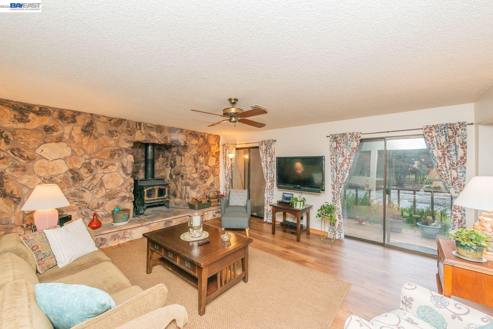 2393 Poker Bar Road Douglas City, CA 96024 - Photo 7 of 52 a living room with furniture and a flat screen tv