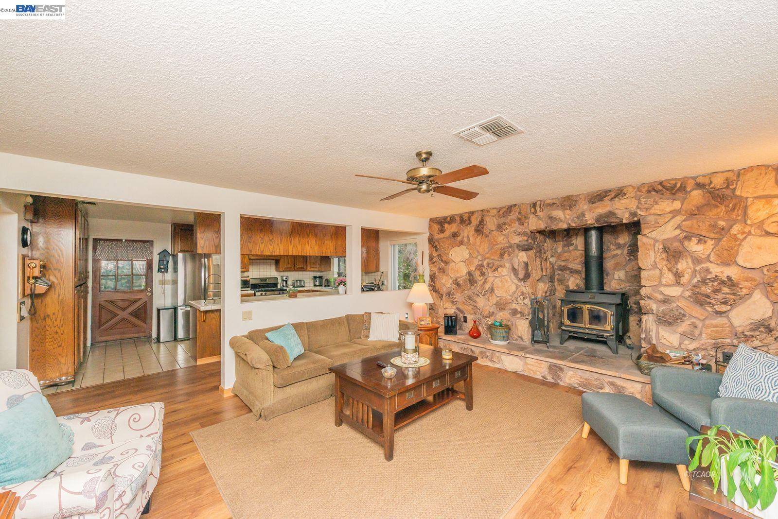 2393 Poker Bar Road Douglas City, CA 96024 - Photo 8 of 52 a living room with furniture and a fireplace