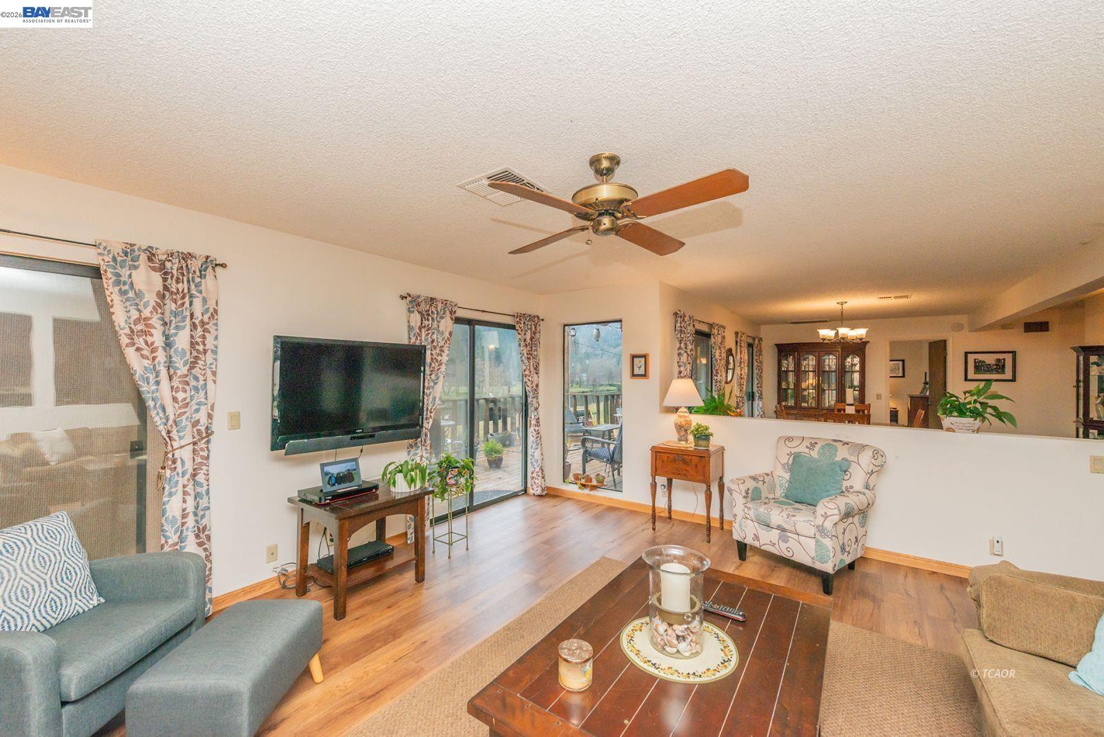 2393 Poker Bar Road Douglas City, CA 96024 - Photo 10 of 52 a living room with furniture and a flat screen tv