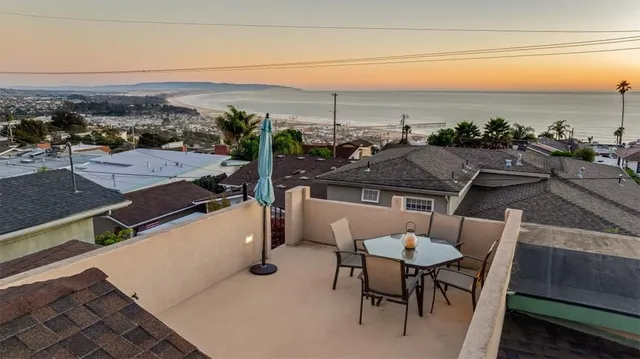 a view of a chairs and table on the terrace