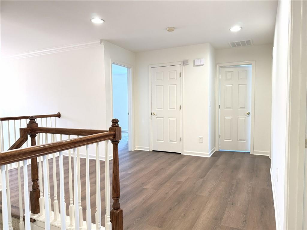 3240 Bentbill Crossing Cumming, GA 30041 - Photo 23 of 30 a view of an empty room with wooden floor