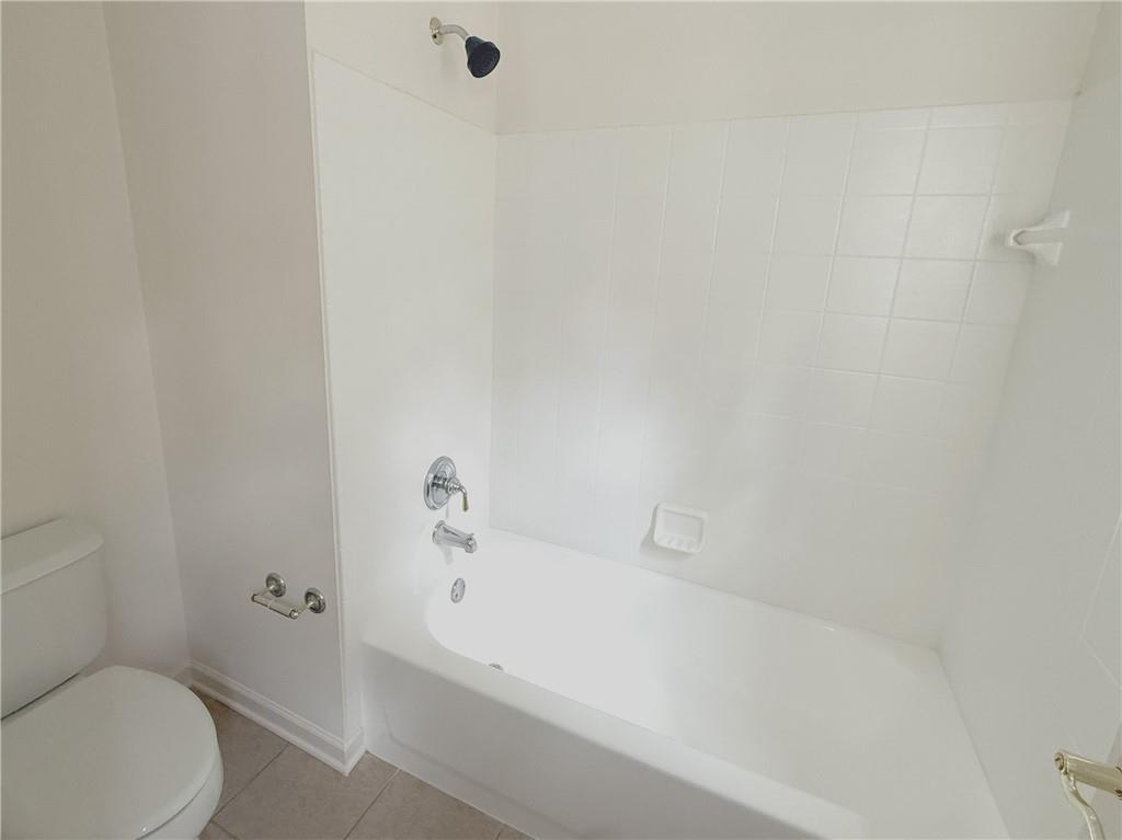 3240 Bentbill Crossing Cumming, GA 30041 - Photo 26 of 30 a bathroom with a bathtub and toilet