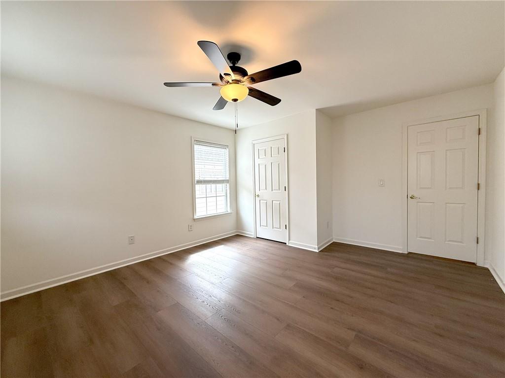 3240 Bentbill Crossing Cumming, GA 30041 - Photo 27 of 30 a view of empty room with wooden floor and fan