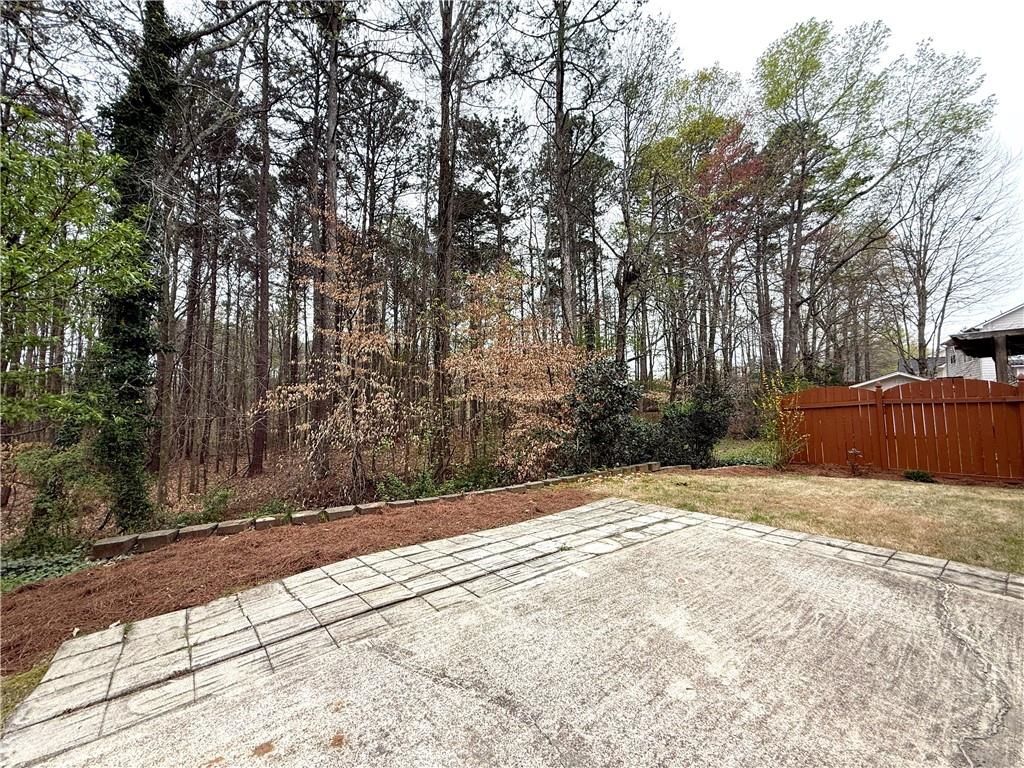 3240 Bentbill Crossing Cumming, GA 30041 - Photo 29 of 30 a view of backyard with large trees