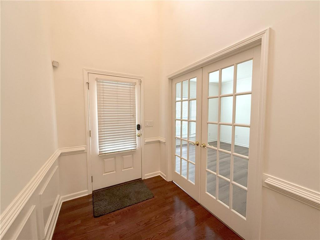 3240 Bentbill Crossing Cumming, GA 30041 - Photo 3 of 30 an empty room with wooden floor and windows