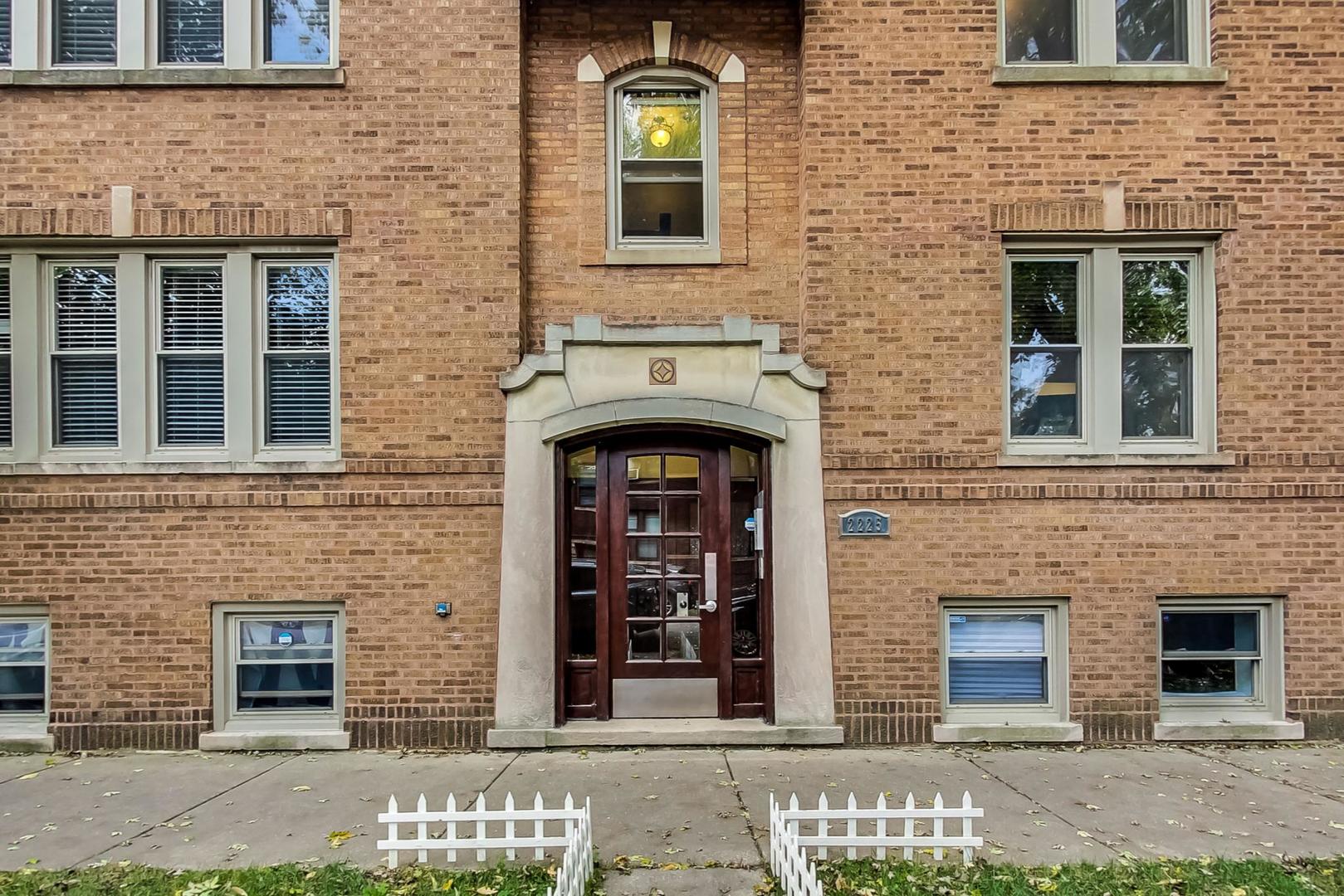 a front view of a brick house with a door