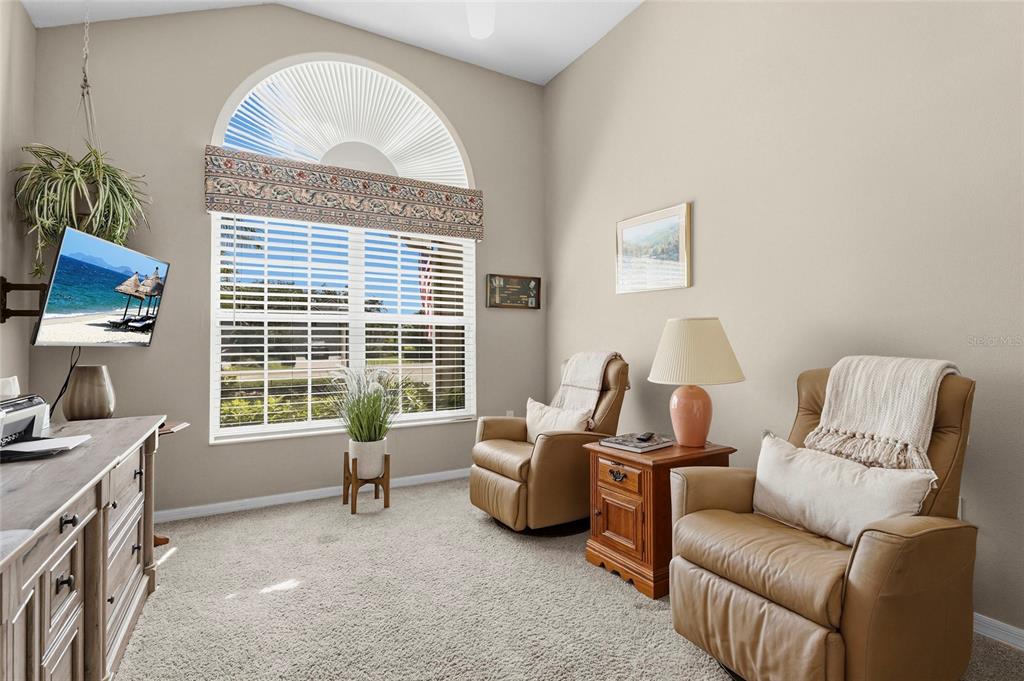 7822 Troon Court Lakewood Ranch, FL 34202 - Photo 12 of 83 a living room with furniture and a large window