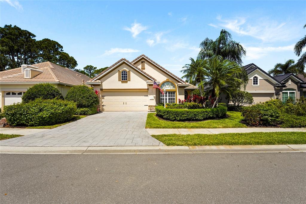 7822 Troon Court Lakewood Ranch, FL 34202 - Photo 18 of 83 front view of a house with a yard