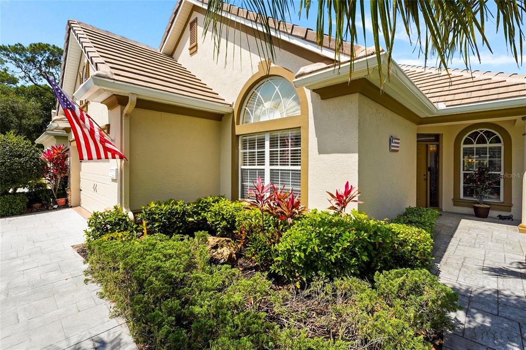 7822 Troon Court Lakewood Ranch, FL 34202 - Photo 21 of 83 a front view of a house with entryway