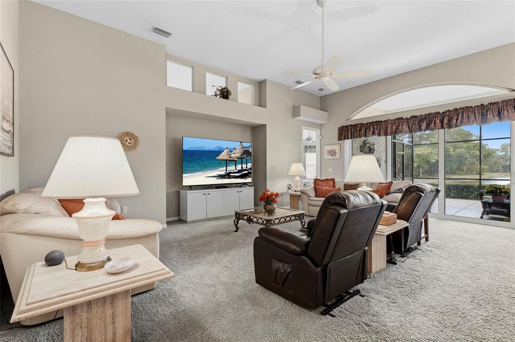 7822 Troon Court Lakewood Ranch, FL 34202 - Photo 26 of 83 a living room with furniture and a large window
