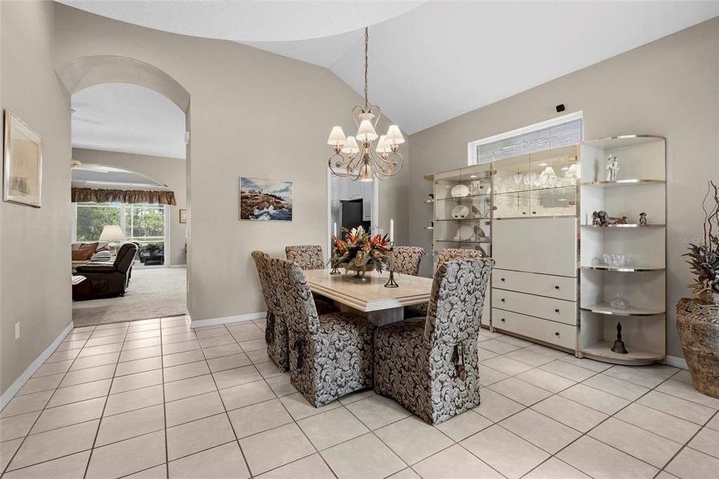 7822 Troon Court Lakewood Ranch, FL 34202 - Photo 29 of 83 a kitchen with stainless steel appliances kitchen island granite countertop a sink and cabinets