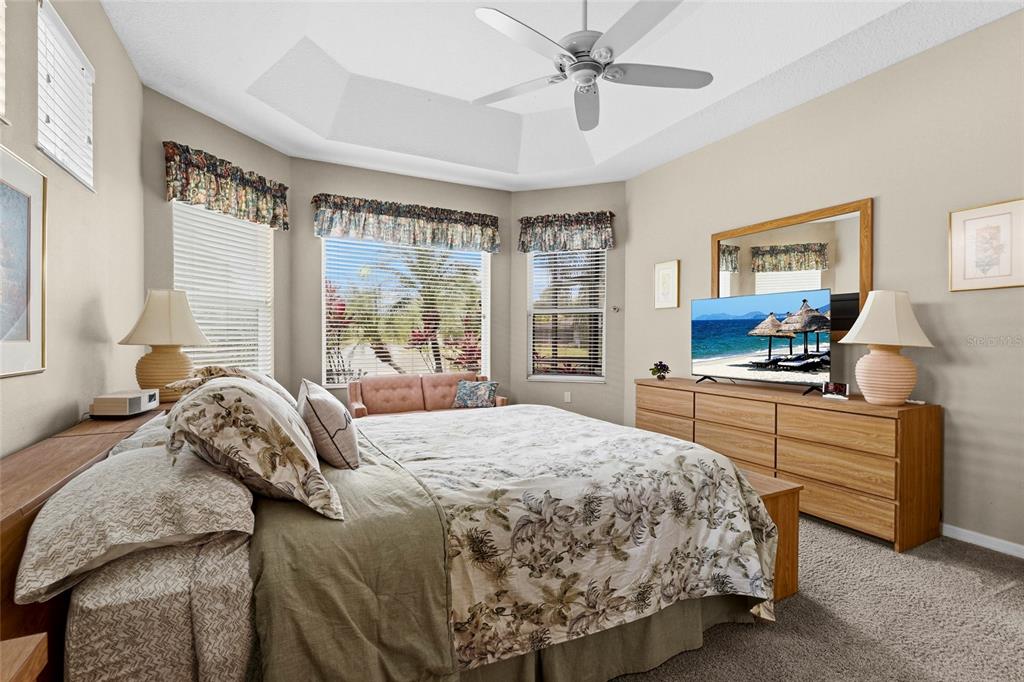 7822 Troon Court Lakewood Ranch, FL 34202 - Photo 31 of 83 a bedroom with a bed and window