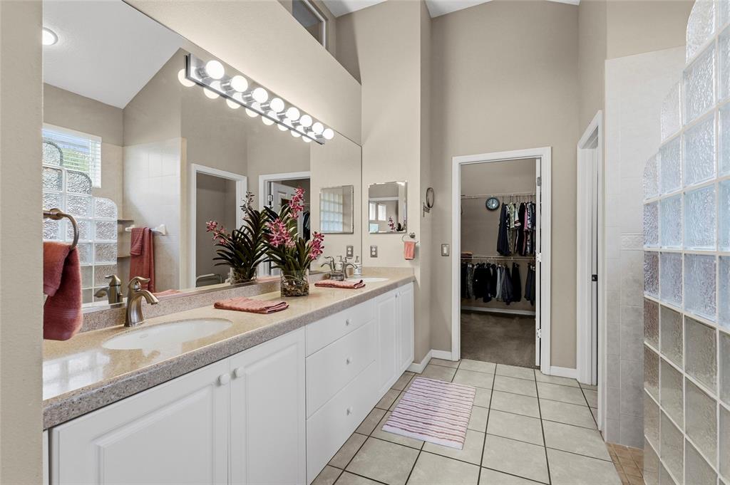 7822 Troon Court Lakewood Ranch, FL 34202 - Photo 33 of 83 a bathroom with a sink a counter and a mirror