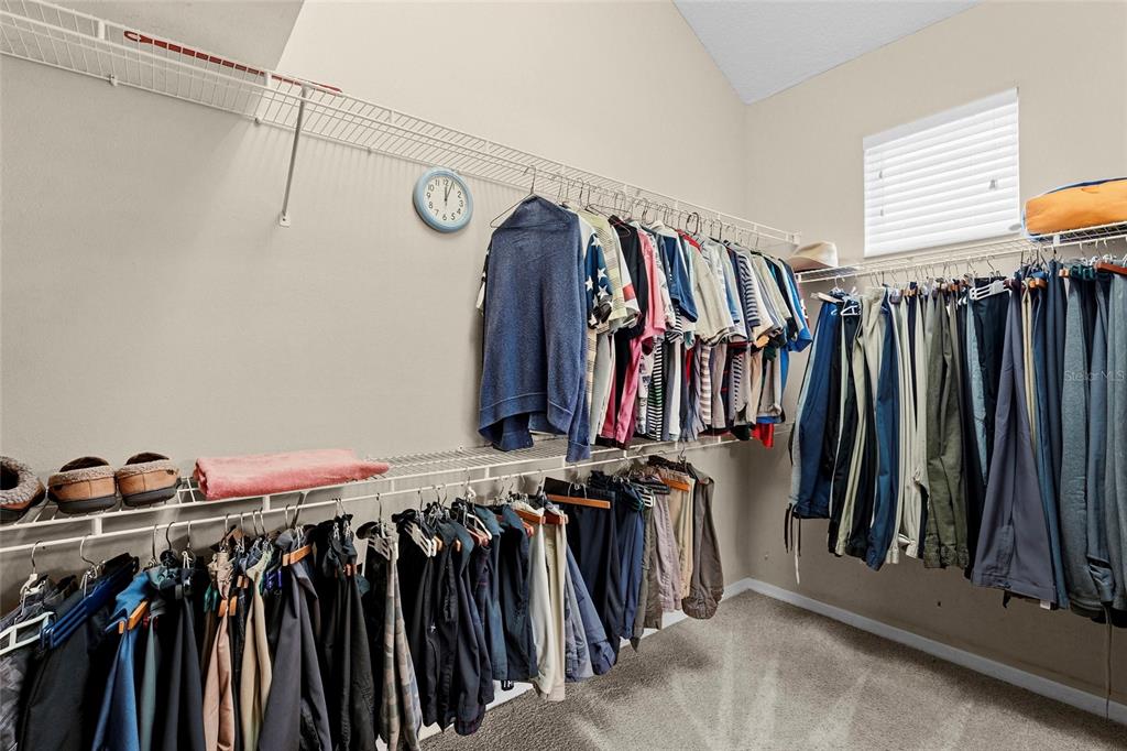 7822 Troon Court Lakewood Ranch, FL 34202 - Photo 35 of 83 a view of walk in closet with clothes
