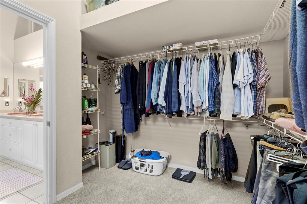 7822 Troon Court Lakewood Ranch, FL 34202 - Photo 36 of 83 a view of walk in closet with clothes