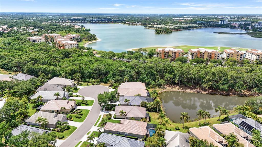 7822 Troon Court Lakewood Ranch, FL 34202 - Photo 58 of 83 an aerial view of house with yard and lake view