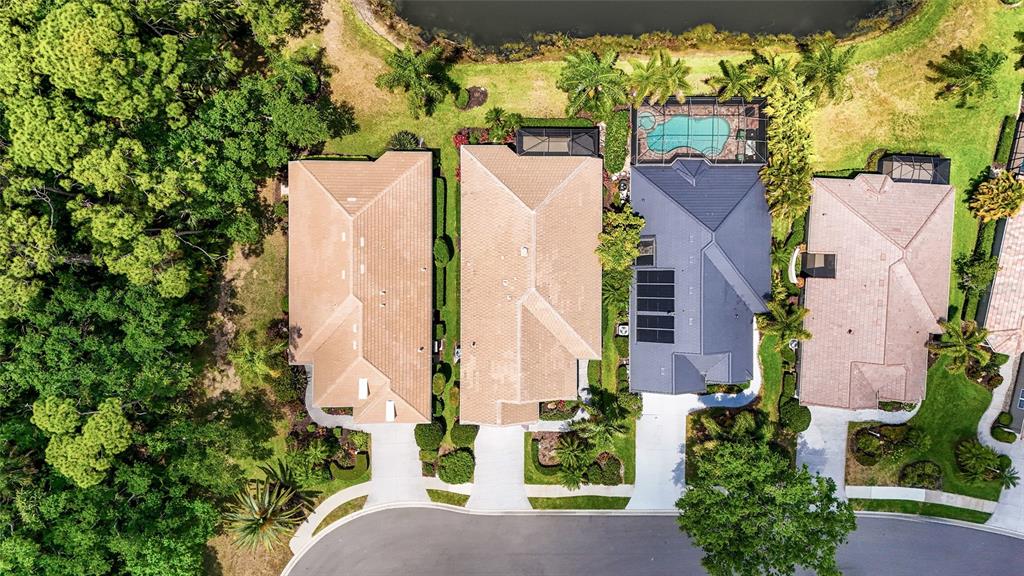 7822 Troon Court Lakewood Ranch, FL 34202 - Photo 62 of 83 an aerial view of residential houses with outdoor space and street view