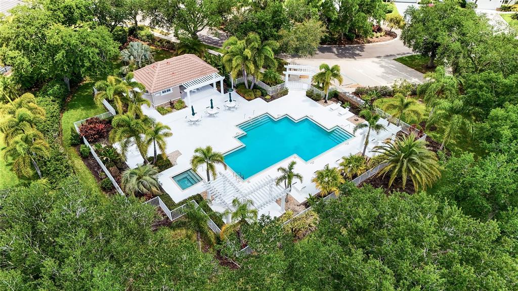 7822 Troon Court Lakewood Ranch, FL 34202 - Photo 66 of 83 a view of backyard of house with outdoor seating