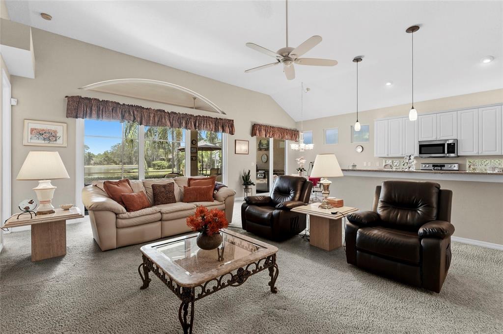 7822 Troon Court Lakewood Ranch, FL 34202 - Photo 7 of 83 a living room with furniture and a large window