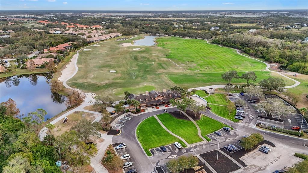 7822 Troon Court Lakewood Ranch, FL 34202 - Photo 82 of 83 an aerial view of a house with outdoor space and a lake view