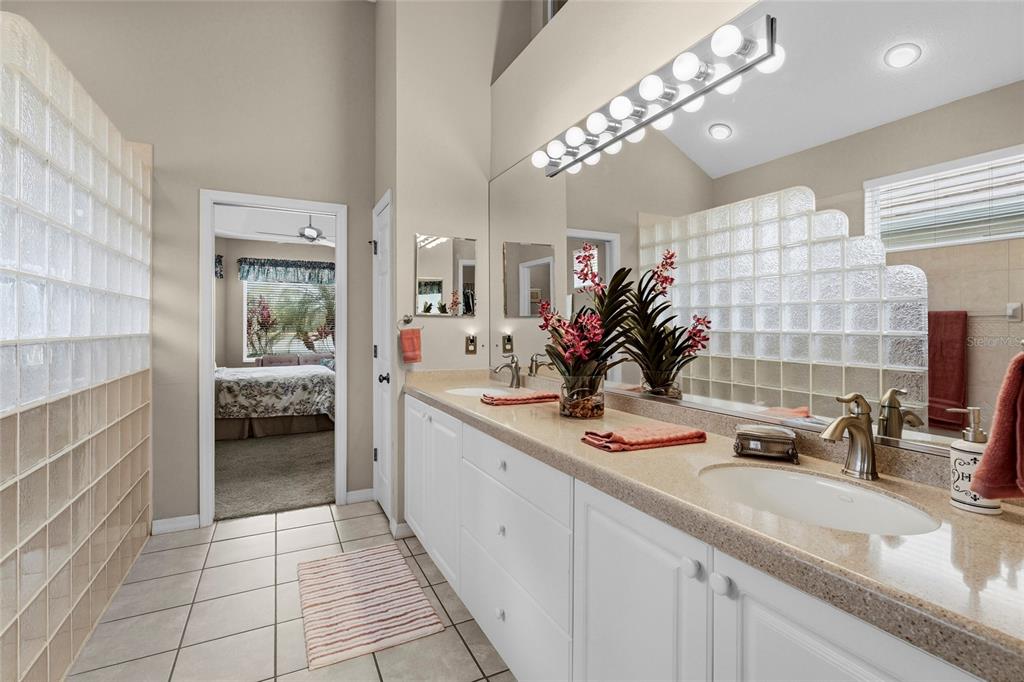 7822 Troon Court Lakewood Ranch, FL 34202 - Photo 10 of 83 a bathroom with a double vanity sink and a mirror