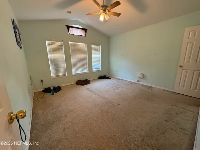 a view of an empty room with a window