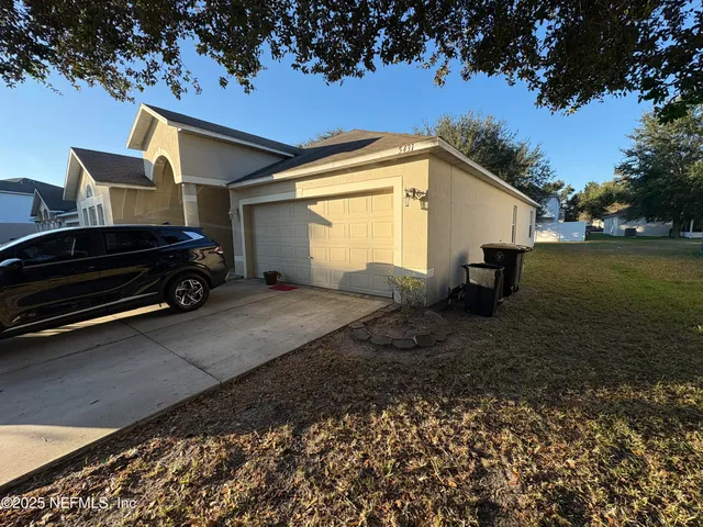 a car parked in front of a house