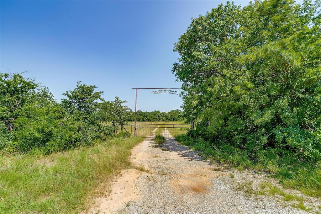 210 Trails End Poolville, TX 76487 - Photo 23 of 25 a view of a lake with a yard