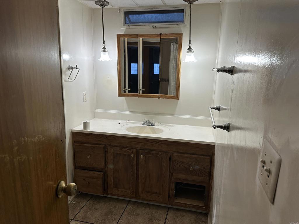 8301 Mission Gorge Road, Unit 274 Santee, CA 92071 - Photo 13 of 41 a bathroom with a sink and a mirror