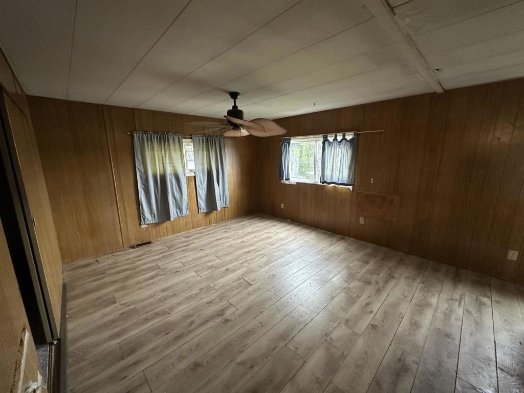 8301 Mission Gorge Road, Unit 274 Santee, CA 92071 - Photo 15 of 41 an empty room with wooden floor and windows