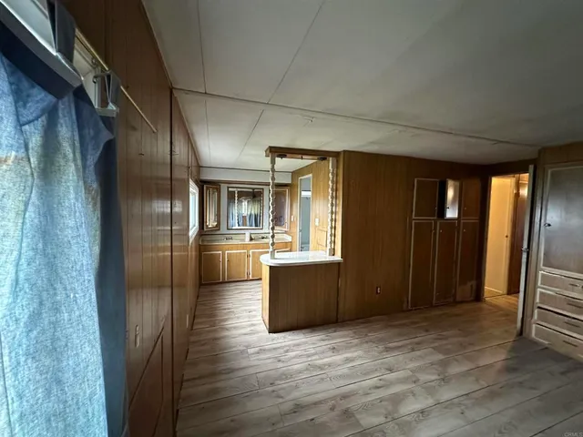 a bathroom with a glass shower door and sink