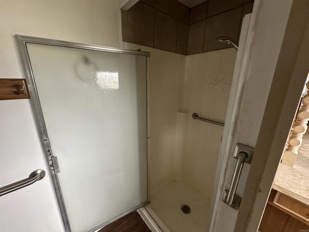 8301 Mission Gorge Road, Unit 274 Santee, CA 92071 - Photo 18 of 41 a bathroom with a glass shower door and sink