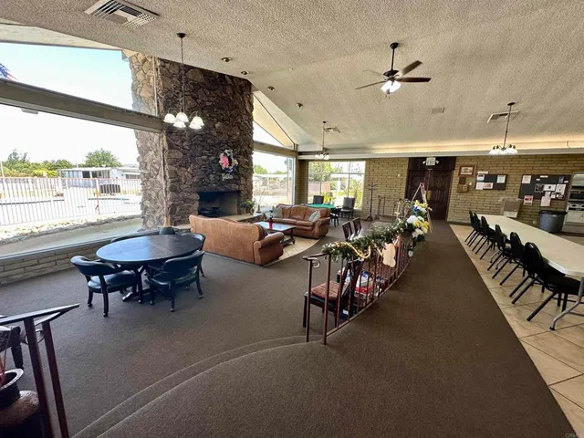 a living room with lots of furniture and a chandelier