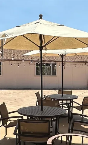 a view of a swimming pool with a lounge chair