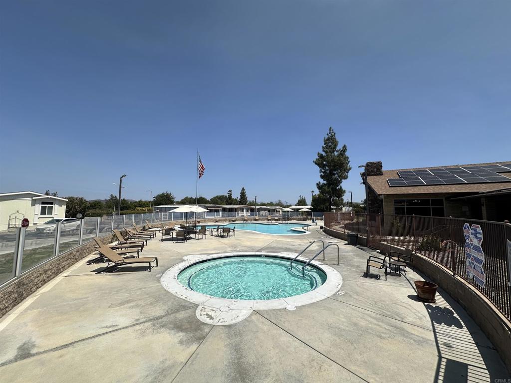 8301 Mission Gorge Road, Unit 274 Santee, CA 92071 - Photo 34 of 41 a view of a swimming pool with a lounge chair