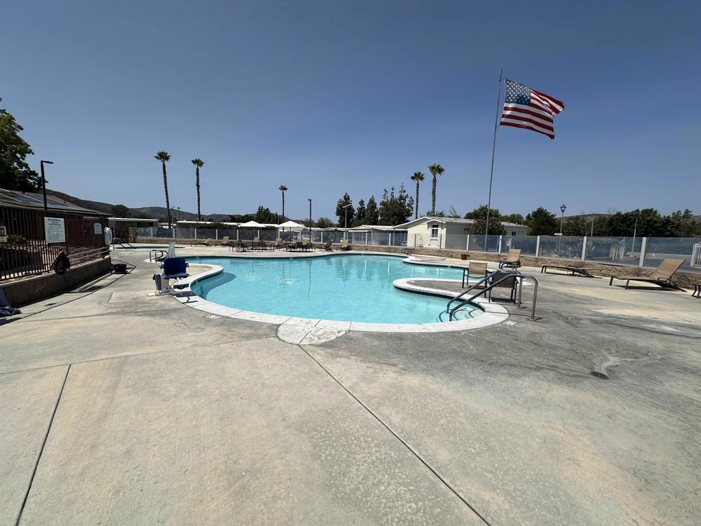 8301 Mission Gorge Road, Unit 274 Santee, CA 92071 - Photo 36 of 41 a view of a swimming pool and lounge chairs