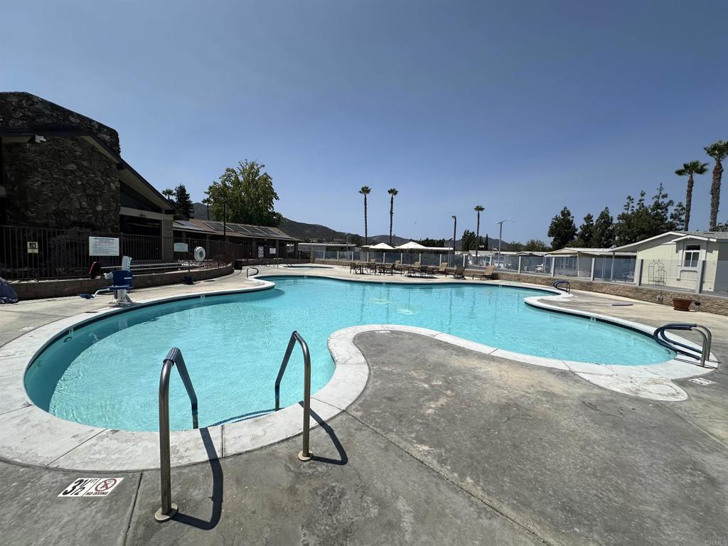8301 Mission Gorge Road, Unit 274 Santee, CA 92071 - Photo 37 of 41 a view of a swimming pool with lounge chair