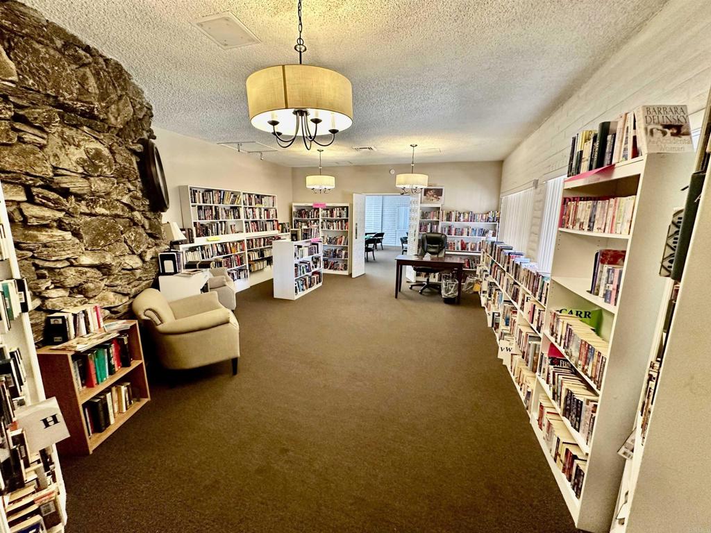 8301 Mission Gorge Road, Unit 274 Santee, CA 92071 - Photo 38 of 41 a living room with furniture and a chandelier