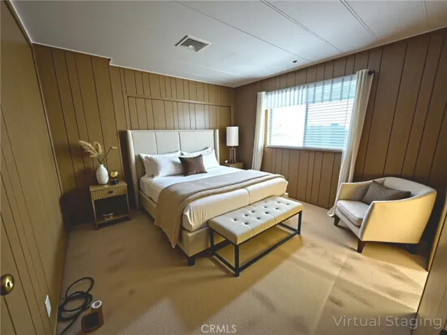 a bedroom with a bed and a window