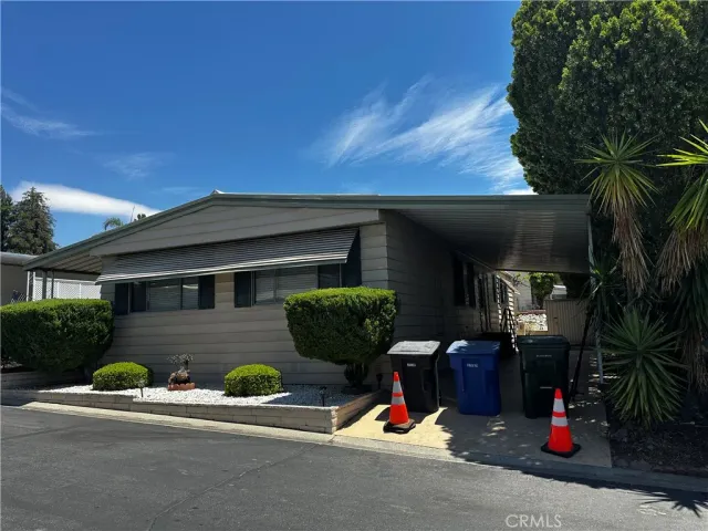 a view of a brick house with a patio